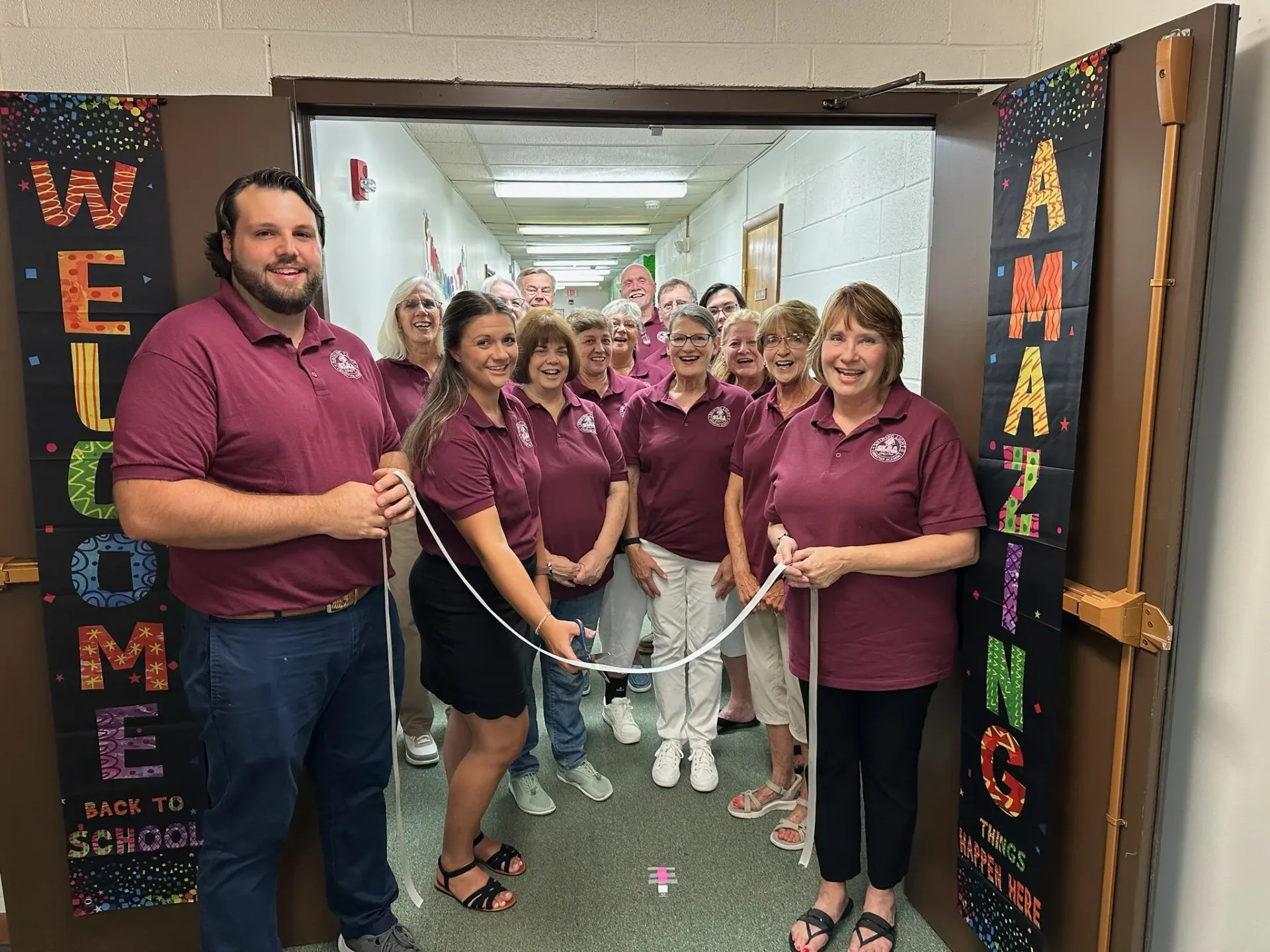 Students and staff at the Shining Light Christian Academy ribbon cutting ceremony